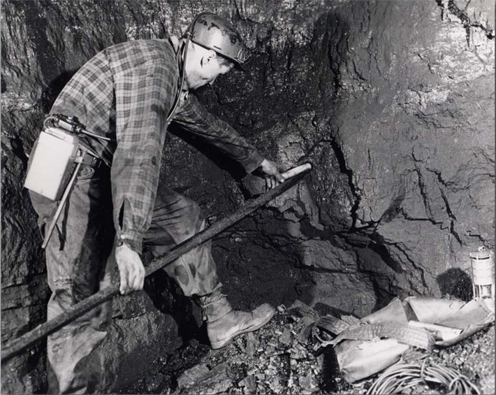 coal miner boring to place explosives