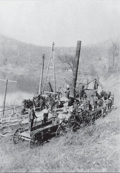 Black and white photo of early oil drilling operation at Burning Springs, Wirt County
