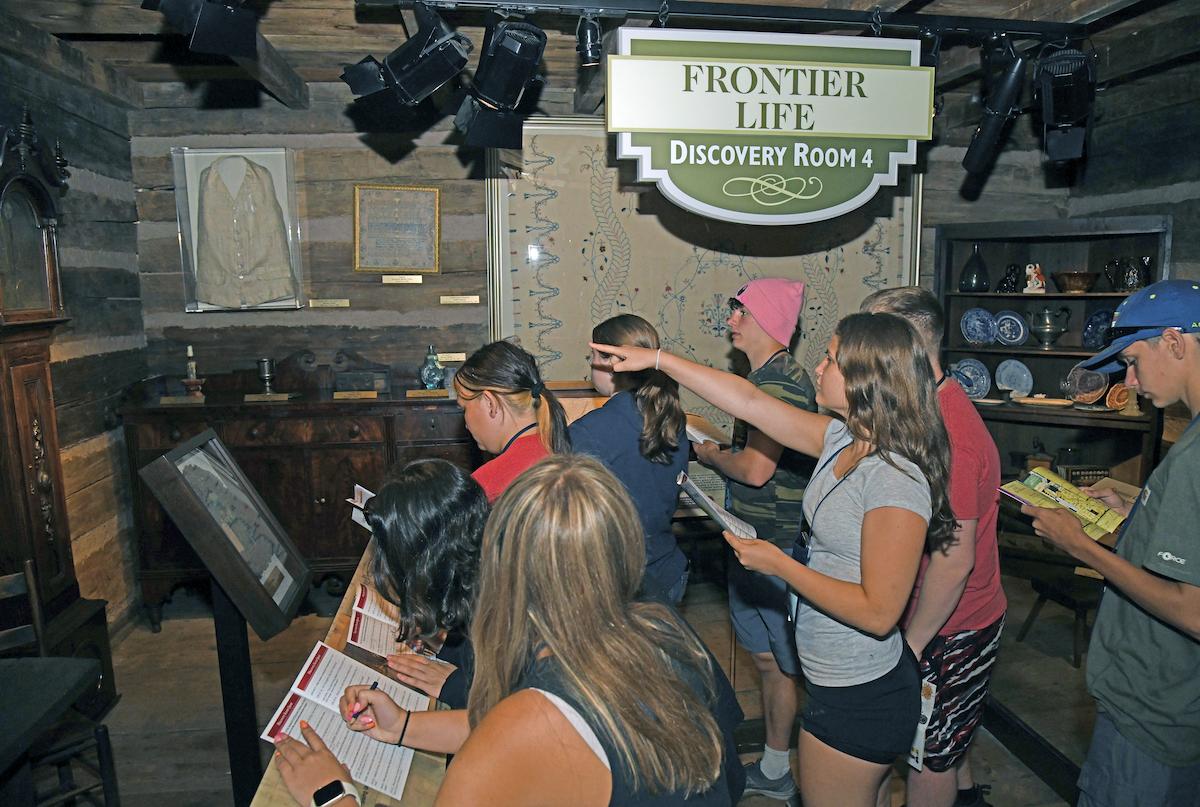 Students explore the Frontier Cabin
